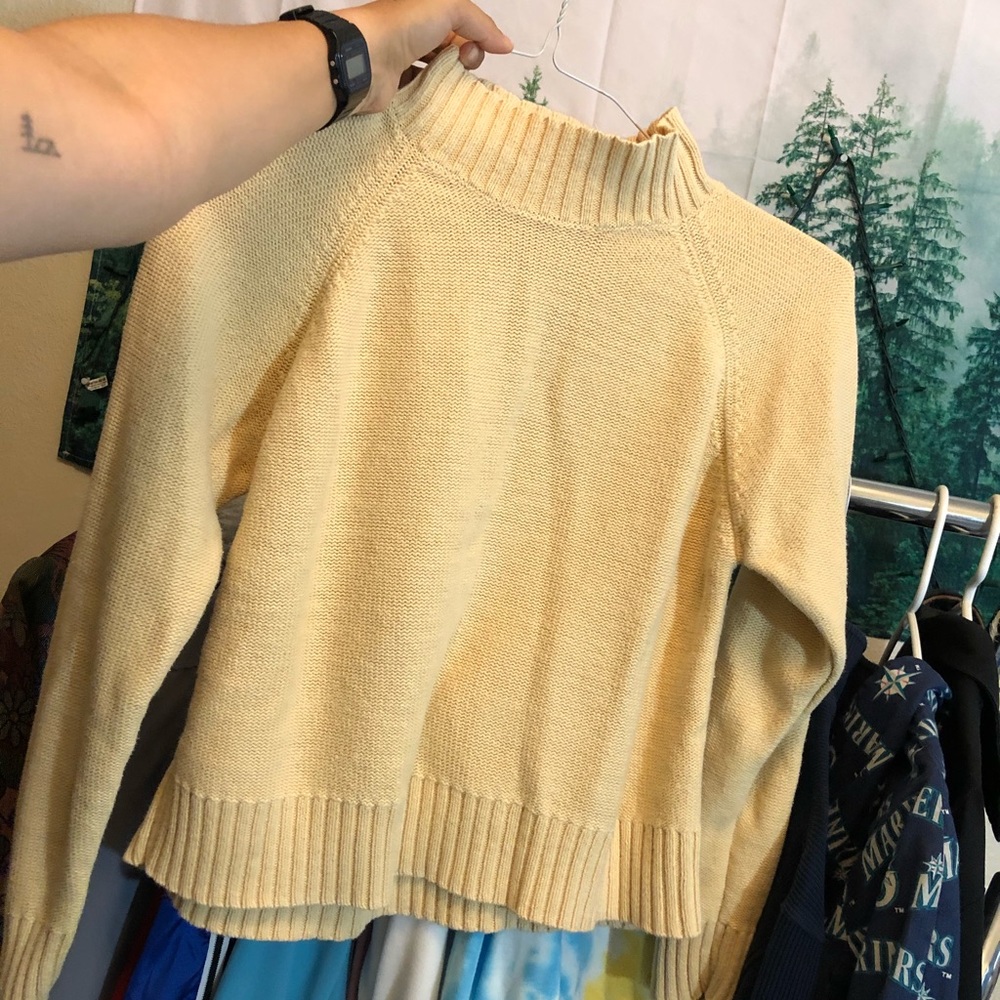 Yellow turtleneck sweater